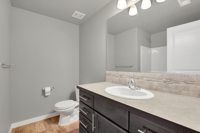 1119 S Soda Rd, Spokane, WA 99224 - full bathroom featuring vanity, wood finished floors, and a shower
