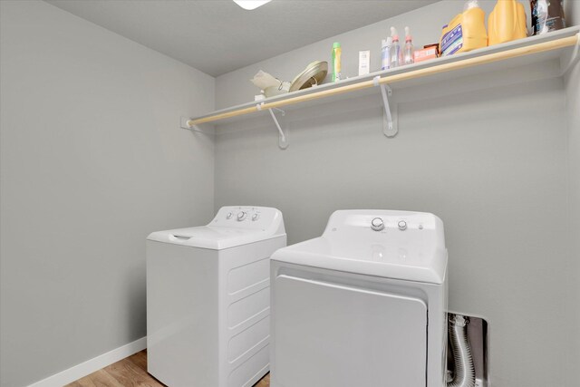 1119 S Soda Rd, Spokane, WA 99224 - laundry area with washer and dryer and light wood-style floors