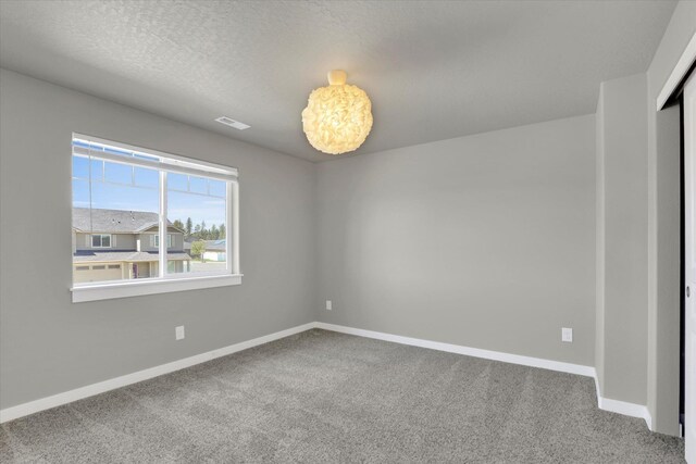 1119 S Soda Rd, Spokane, WA 99224 - carpeted empty room featuring baseboards
