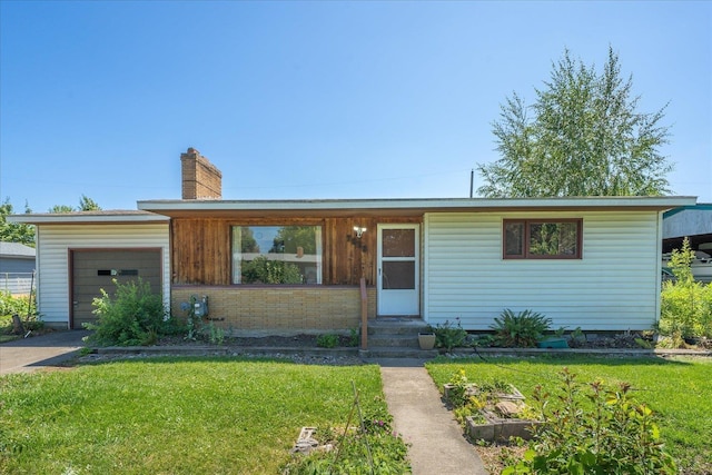 7616 E Baldwin Ave, Spokane, WA 99212 - single story home featuring a front lawn, driveway, a garage, and a chimney