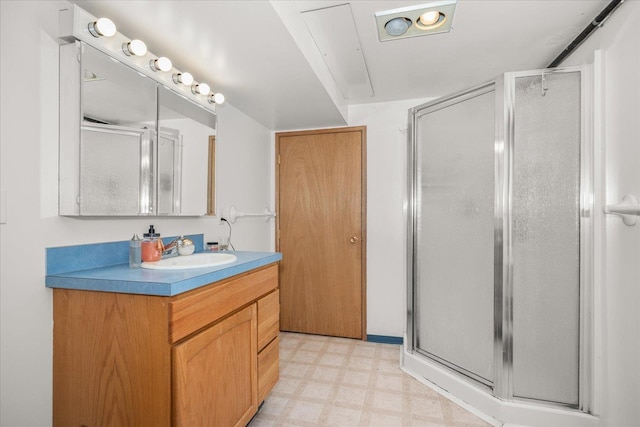 7616 E Baldwin Ave, Spokane, WA 99212 - bathroom featuring tile patterned floors, vanity, and a stall shower