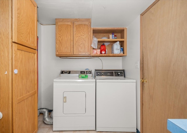 7616 E Baldwin Ave, Spokane, WA 99212 - washroom featuring cabinet space and separate washer and dryer