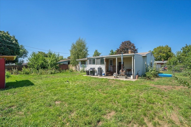 7616 E Baldwin Ave, Spokane, WA 99212 - back of house featuring a patio area and a fenced backyard