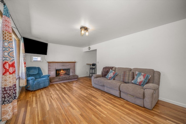 7616 E Baldwin Ave, Spokane, WA 99212 - living area with light wood finished floors and a brick fireplace