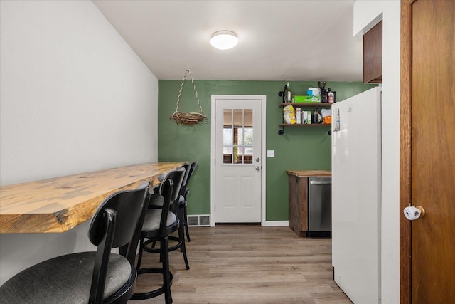 7616 E Baldwin Ave, Spokane, WA 99212 - kitchen featuring dishwasher, light wood-type flooring, and freestanding refrigerator
