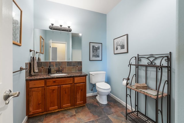 9617 N Northview Ln, Spokane, WA 99208 - bathroom with vanity, stone finish flooring, and backsplash