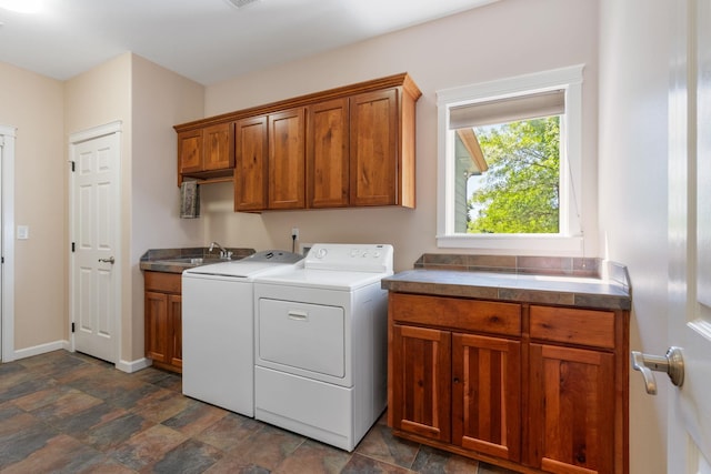 9617 N Northview Ln, Spokane, WA 99208 - laundry area featuring cabinet space, washing machine and clothes dryer, and stone finish floors
