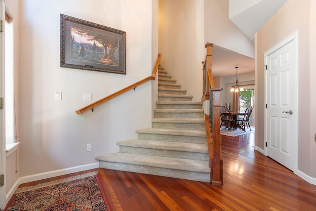 9617 N Northview Ln, Spokane, WA 99208 - stairway with wood finished floors and a chandelier