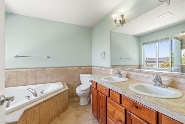 9617 N Northview Ln, Spokane, WA 99208 - full bath with a garden tub, tile patterned flooring, double vanity, wainscoting, and tile walls