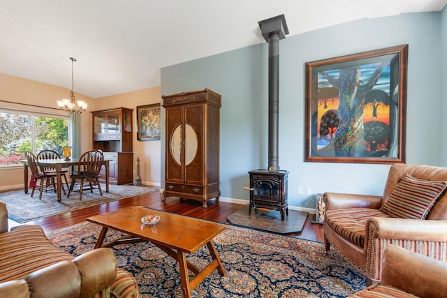 9617 N Northview Ln, Spokane, WA 99208 - living area featuring a wood stove, a chandelier, wood finished floors, and lofted ceiling