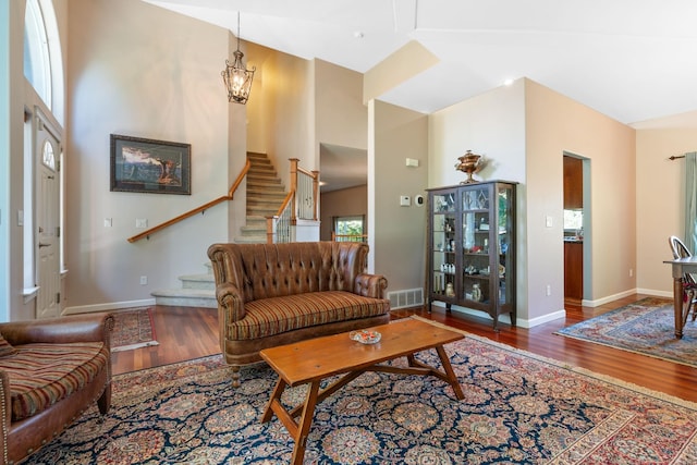 9617 N Northview Ln, Spokane, WA 99208 - living room with wood finished floors, stairway, a towering ceiling, and a chandelier