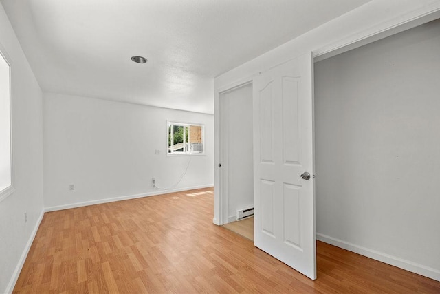 1937 W 15th Ave, Spokane, WA 99224 - unfurnished bedroom featuring baseboard heating and light wood finished floors
