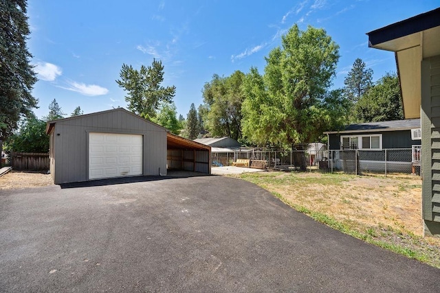 1937 W 15th Ave, Spokane, WA 99224 - garage with asphalt driveway and a detached garage