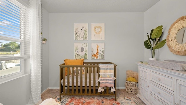 3745 S Keller Ln, Spokane Valley, WA 99206 - bedroom featuring light colored carpet and a crib
