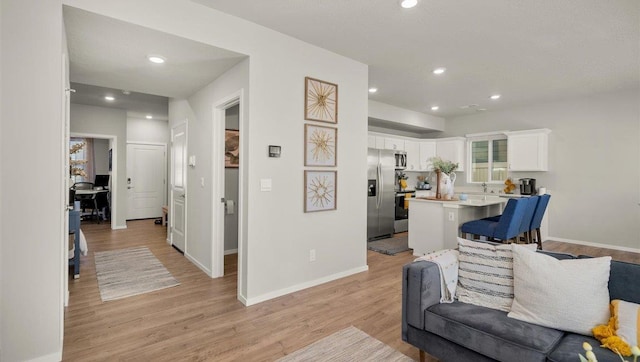 3745 S Keller Ln, Spokane Valley, WA 99206 - living room featuring light wood-type flooring and recessed lighting