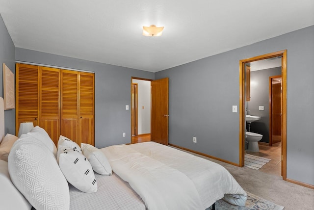 201 W Barnes Rd, Spokane, WA 99218 - carpeted bedroom featuring a closet and ensuite bathroom
