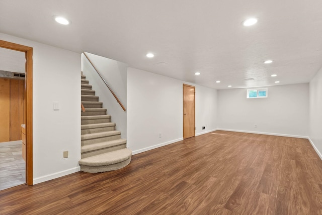 201 W Barnes Rd, Spokane, WA 99218 - below grade area with wood finished floors, recessed lighting, and stairway