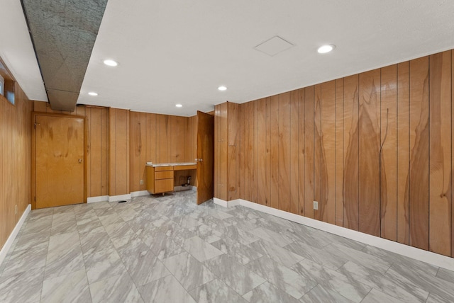 201 W Barnes Rd, Spokane, WA 99218 - finished below grade area featuring wood walls, recessed lighting, and light marble finish flooring