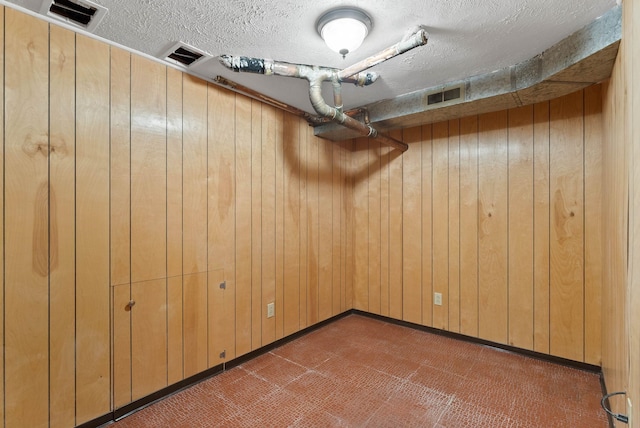 201 W Barnes Rd, Spokane, WA 99218 - finished basement featuring wooden walls and a textured ceiling