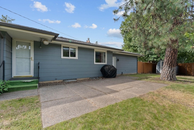 201 W Barnes Rd, Spokane, WA 99218 - back of house featuring a patio and a storage unit