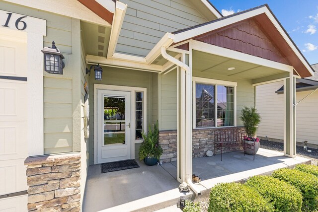 3316 N Coleman St, Post Falls, ID 83854 - doorway to property with a porch