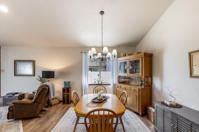 3316 N Coleman St, Post Falls, ID 83854 - dining space featuring a chandelier and wood finished floors