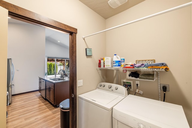 3316 N Coleman St, Post Falls, ID 83854 - laundry area featuring washer and clothes dryer and light wood-style floors