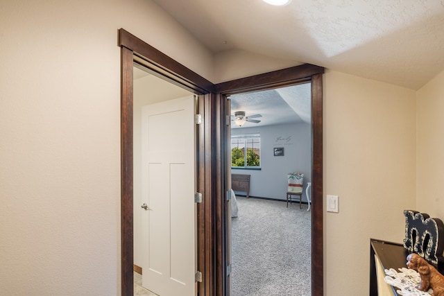 3316 N Coleman St, Post Falls, ID 83854 - hallway featuring light colored carpet, lofted ceiling, and a textured ceiling