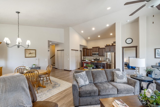 3316 N Coleman St, Post Falls, ID 83854 - living room featuring high vaulted ceiling, a chandelier, light wood-style flooring, a ceiling fan, and recessed lighting