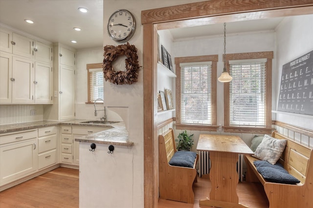 927 W 19th Ave, Spokane, WA 99203 - kitchen with breakfast area, healthy amount of natural light, light stone counters, white cabinets, and recessed lighting
