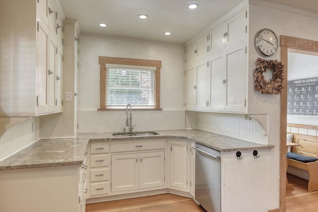 927 W 19th Ave, Spokane, WA 99203 - kitchen featuring stainless steel dishwasher, ornamental molding, white cabinets, light stone counters, and light wood-style floors