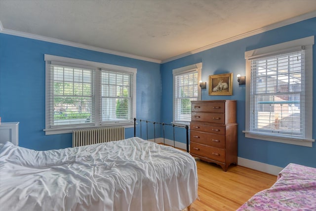 927 W 19th Ave, Spokane, WA 99203 - bedroom featuring radiator, light wood finished floors, and ornamental molding