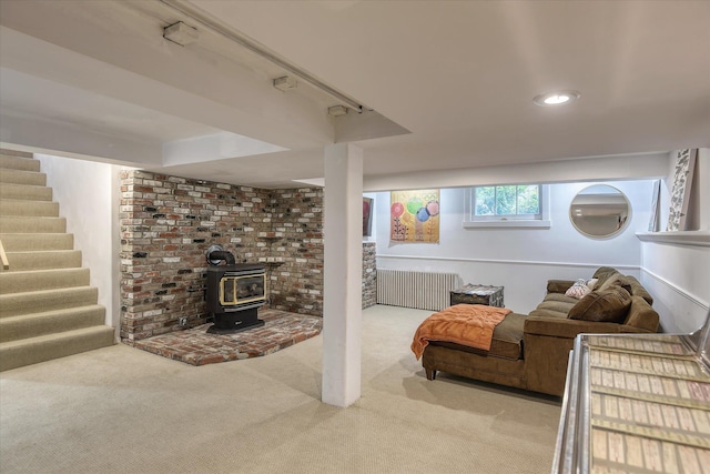 927 W 19th Ave, Spokane, WA 99203 - living area with radiator, carpet, stairway, recessed lighting, and a wood stove