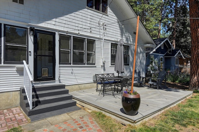 927 W 19th Ave, Spokane, WA 99203 - rear view of house featuring entry steps, a deck, and outdoor dining area