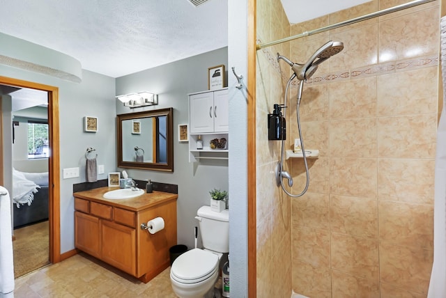 11606 E 8th Ave, Spokane Valley, WA 99206 - full bathroom featuring connected bathroom, vanity, and tiled shower