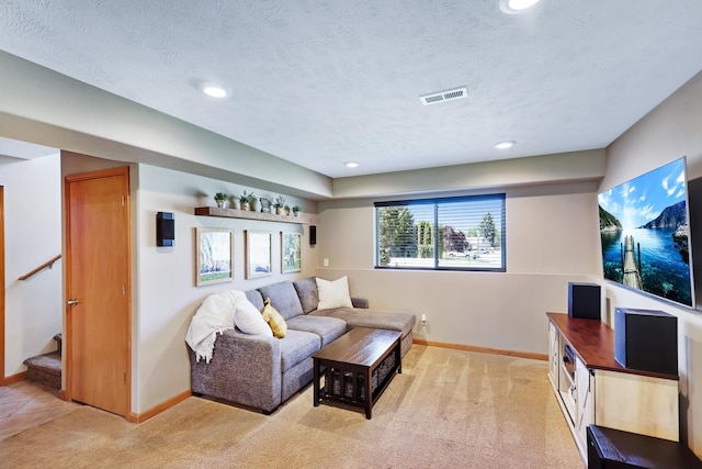 11606 E 8th Ave, Spokane Valley, WA 99206 - living area with light colored carpet, recessed lighting, stairway, and a textured ceiling