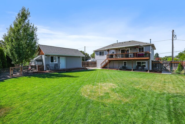 11606 E 8th Ave, Spokane Valley, WA 99206 - back of house with stairway, a fenced backyard, and a deck