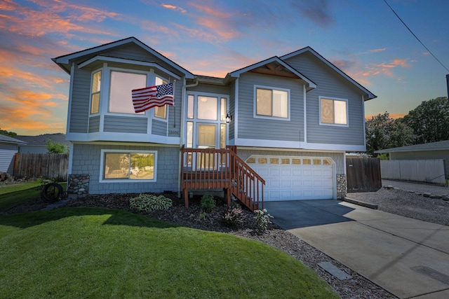 11606 E 8th Ave, Spokane Valley, WA 99206 - view of front facade with a garage, concrete driveway, and stone siding