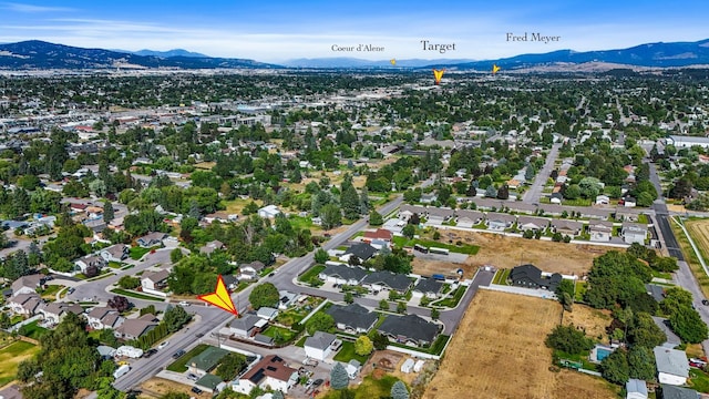 11606 E 8th Ave, Spokane Valley, WA 99206 - aerial overview of property's location with a mountainous background and nearby suburban area