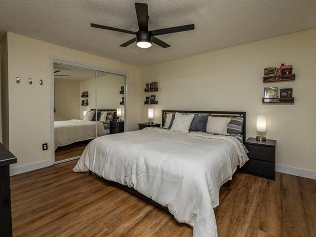 10108 E 19th Ave, Spokane Valley, WA 99206 - bedroom featuring wood finished floors, a closet, a textured ceiling, and ceiling fan