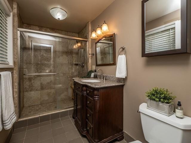 10108 E 19th Ave, Spokane Valley, WA 99206 - full bathroom with vanity, tile patterned floors, and a shower stall