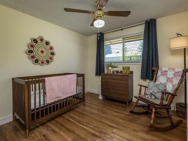 10108 E 19th Ave, Spokane Valley, WA 99206 - bedroom with wood finished floors, a textured ceiling, and ceiling fan