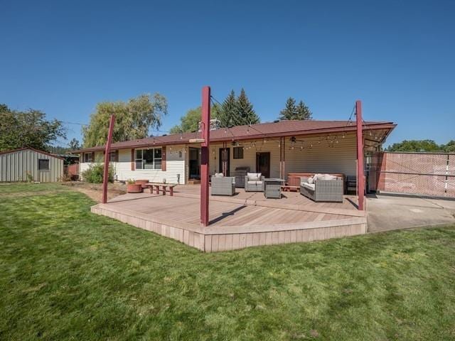 10108 E 19th Ave, Spokane Valley, WA 99206 - rear view of property featuring outdoor lounge area, a ceiling fan, a patio area, and a shed