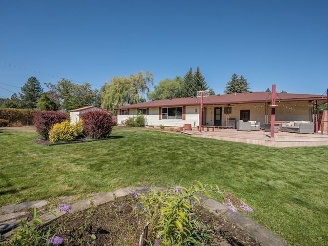 10108 E 19th Ave, Spokane Valley, WA 99206 - back of house with outdoor lounge area, a yard, and a patio