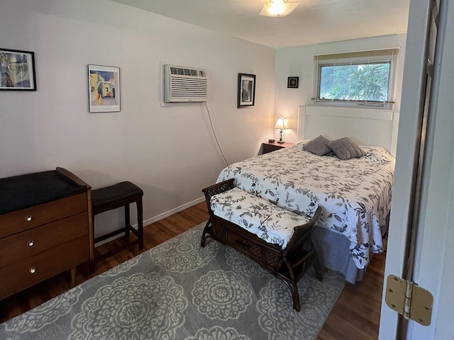 816 S Mamer Rd, Spokane Valley, WA 99216 - bedroom featuring an AC wall unit and wood finished floors
