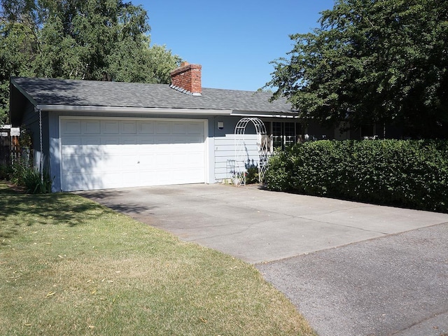 816 S Mamer Rd, Spokane Valley, WA 99216 - view of front of house with a chimney, a shingled roof, a front lawn, and driveway