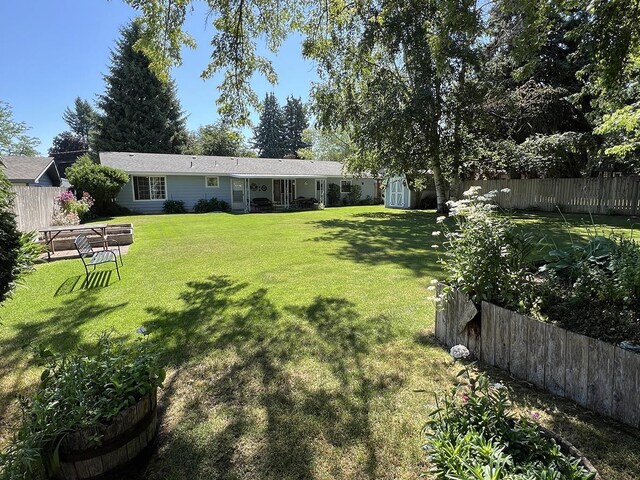 816 S Mamer Rd, Spokane Valley, WA 99216 - fenced backyard with a storage shed