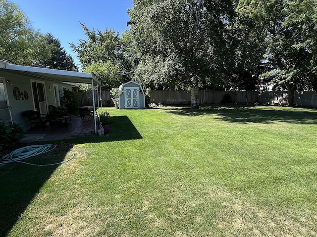 816 S Mamer Rd, Spokane Valley, WA 99216 - fenced backyard featuring a patio and a storage unit
