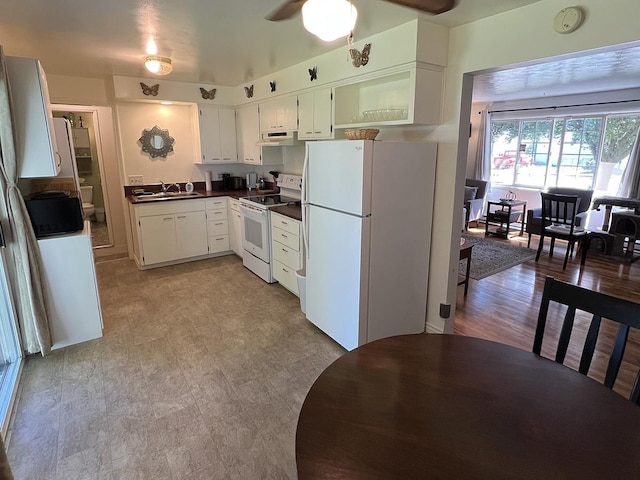 816 S Mamer Rd, Spokane Valley, WA 99216 - kitchen featuring white appliances, dark countertops, under cabinet range hood, a ceiling fan, and white cabinets