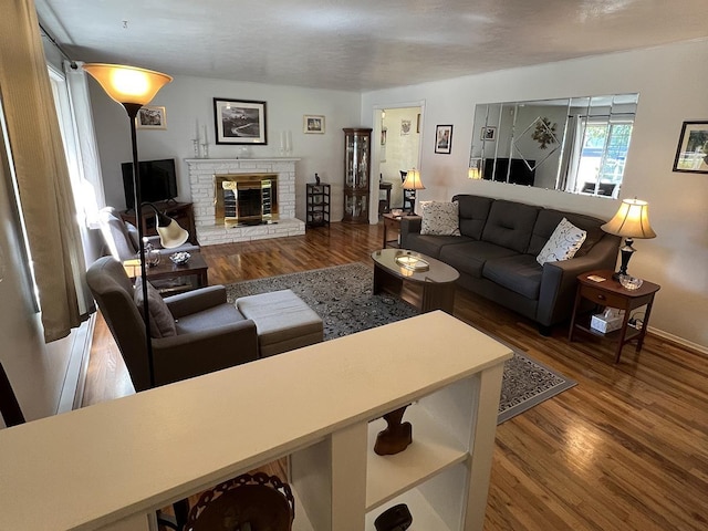 816 S Mamer Rd, Spokane Valley, WA 99216 - living room featuring wood finished floors and a brick fireplace